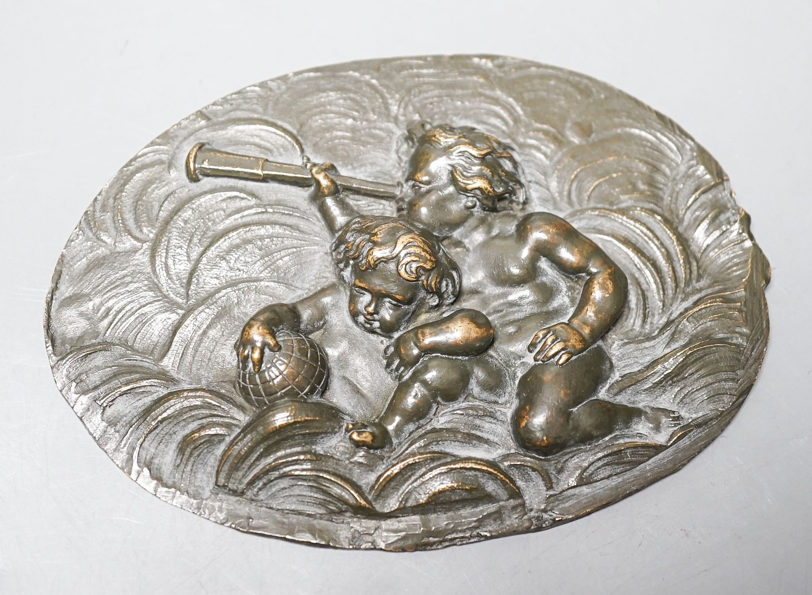 A Renaissance or later bronze 'astronomy' cherub plaque 11.5cm